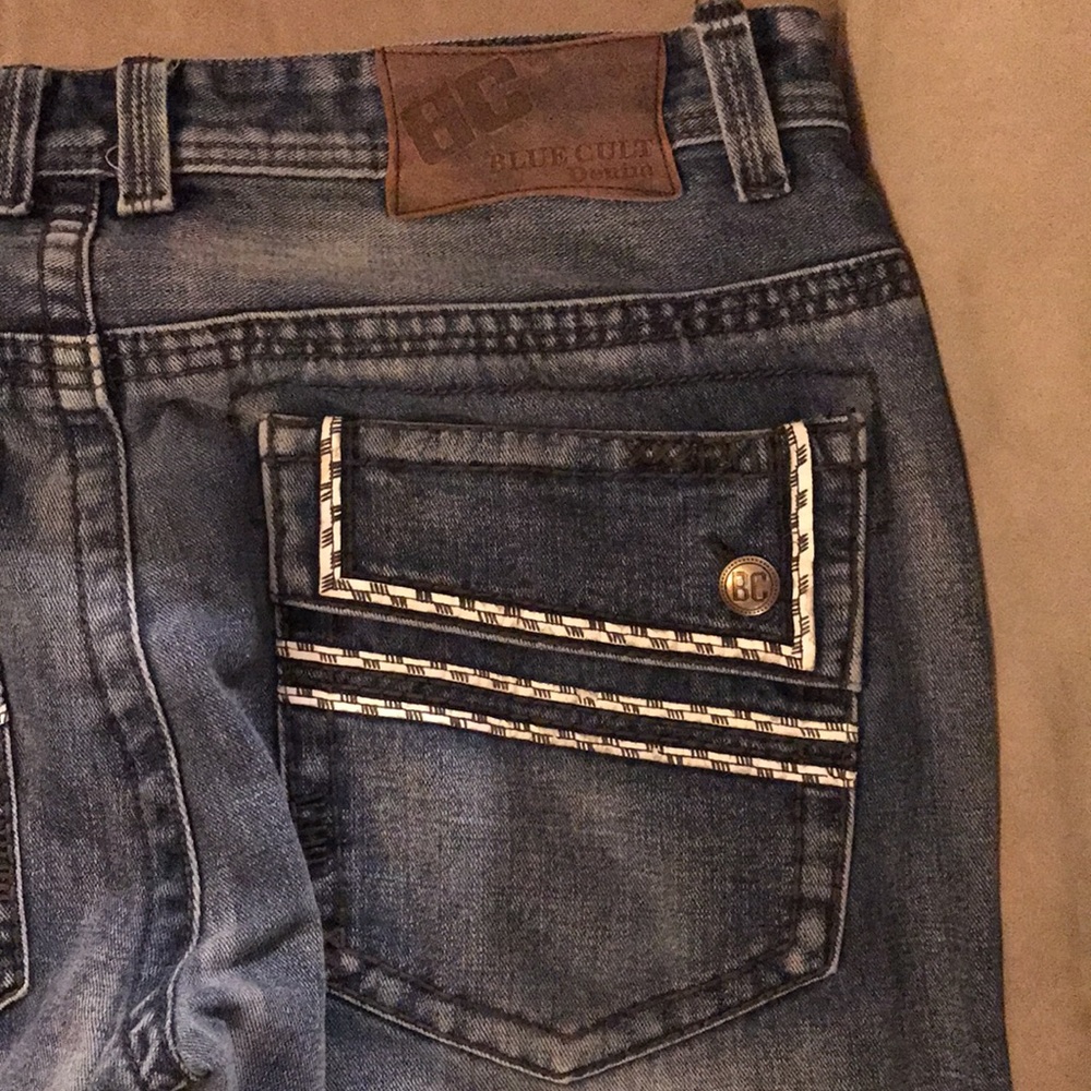 Men’s Blue Cult distressed washed jeans. Size 38.